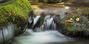 Water passing over rocks on Stock Ghyll beck, near Ambleside, Cumbria, England. EL022