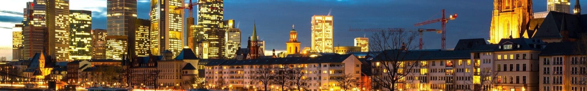 Dusk on the Main as a barge passes in Frankfurt am Main, Hesse, Germany FF021