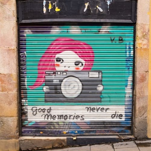 Painted roller door with tag &#039;Good Memories Never Die&#039; in Barcelona, Spain. BC008