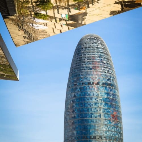 Reflection in mirrored roof of the Encants Vells Flea Market, with the Agbar Tower in the background, Barcelona Spain. BC016