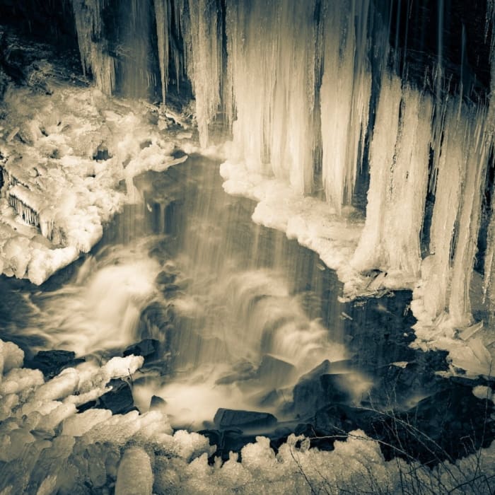 Duotone of a part frozen Grassy Creek Falls, near Little Switzerland, North Carolina, USA. CM017