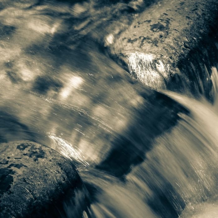 Cyan toned image of water detail, North Carolina, USA.