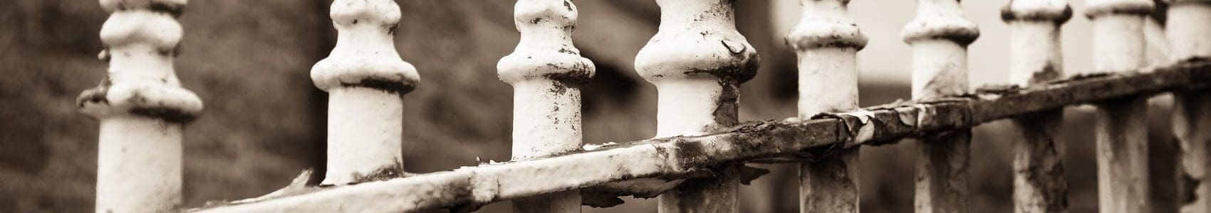 Sepia-toned monochrome image of railings in Stromness, Orkney, Scotland. SM030