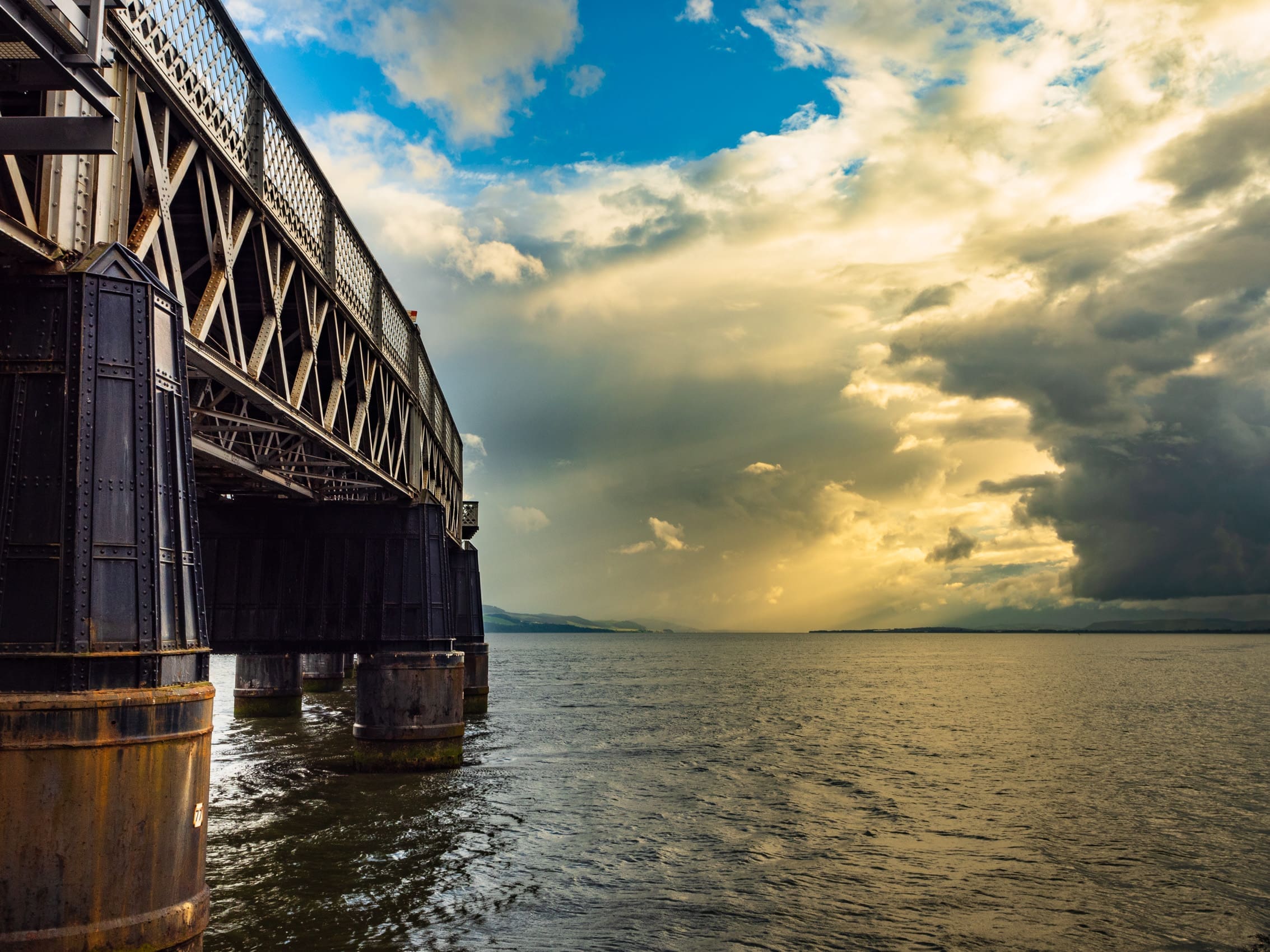 Piers of the Tay Bridge and dramatic cloud, from Dundee, Scotland. DD098