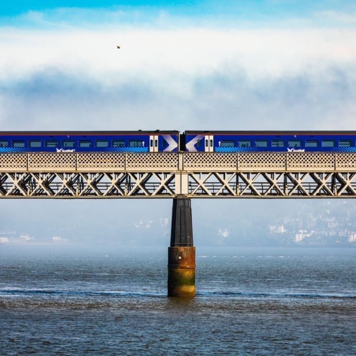 Train crossing the Tay Railway Bridge in fornt of a fog-bank, Dundee, Scotland. DD083