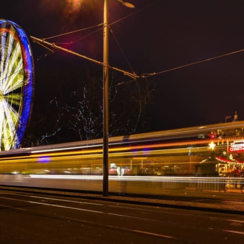 Light trails and a giant Ferris Wheel in Princes Street, Edinburgh, Scotland. EH012