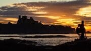 Tantallon Castle silhouetted against the sunset from Seacliff, East Lothian, Scotland. LN003