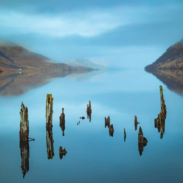 Rotting old pier supports at the head of Loch Arkaig, Lochaber, Scotland. LR002