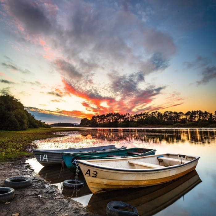 Moored boats on Gladhouse Reservoir, Midlothian, Scotland. LN002