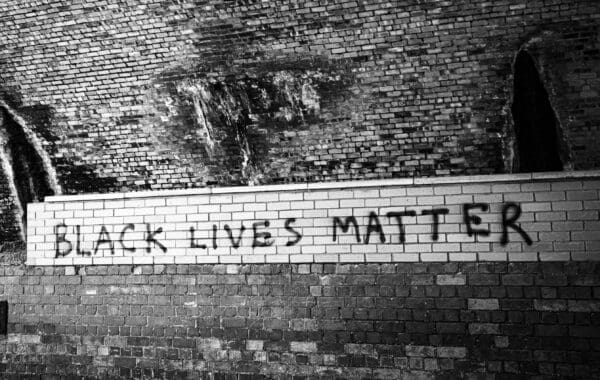 Slogan painted under the Tay Rail Bridge, Wormit, Fife, Scotland. SM058