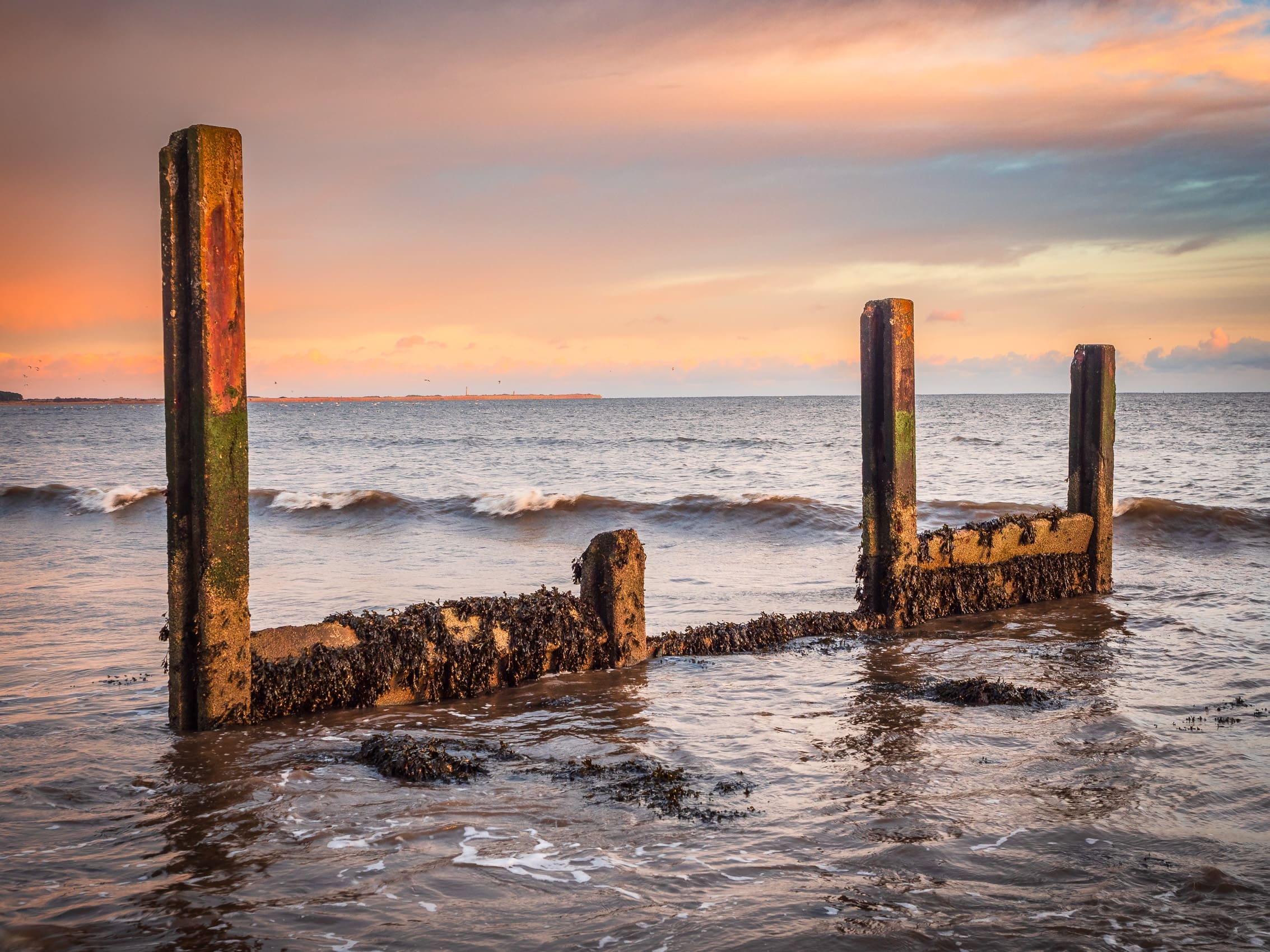 The remains of a concrete groyne on Broughty Ferry beach, Dundee, Scotland.