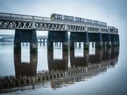 Train passsing over the Tay Railway Bridge in mist Dundee, Scotland. DD172