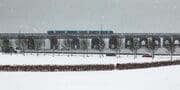 Train crossing the Tay Railway Bridge in a snowstorm, Dundee, Scotland. DD168