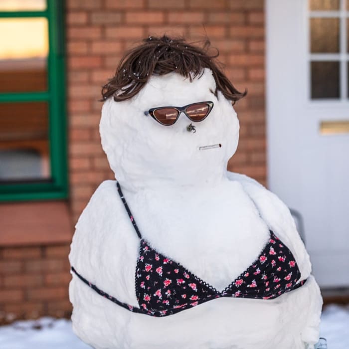 Mrs Snowman, relaxing outside her house on Taylor&#039;s Lane, Dundee, Scotland. DD124