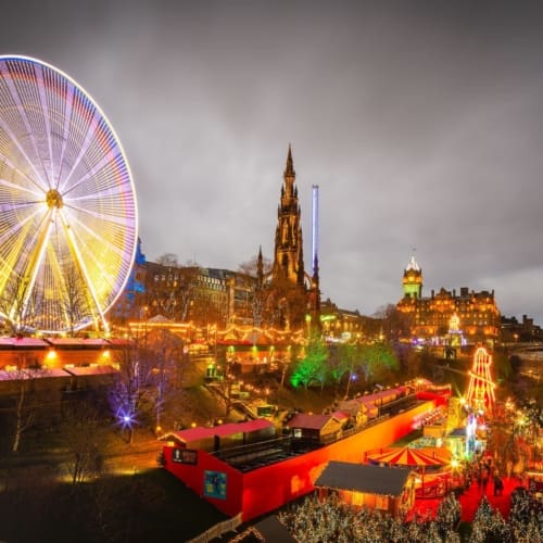 Giant Ferris Wheel and other attractions in Princes Street Gardens on New Years Day, Edinburgh, Scotland, EH007