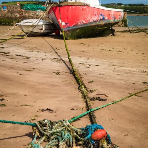 Boats beached at Youghal Harbour, County Cork, Ireland. BW003