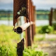 Broken metal barrier at Ballynaclash Quay on the River Blackwater, County Waterford, Ireland.