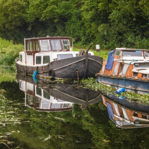 Boats on a lateral canal of the Barrow Navigation at St Mullin&#039;s (Tigh Moling), County Carlow, Ireland. BR003