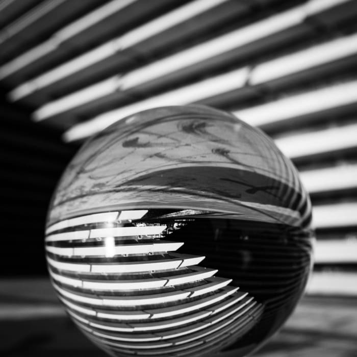 V&amp;A Dundee building reflected in a glass sphere, Dundee, Scotland.