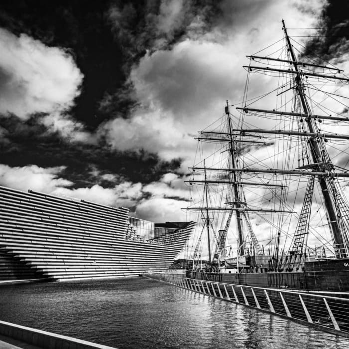 Monochrome (black and white) image of RRS Discovery and the V&amp;A Dundee, Dundee, Scotland. DD023