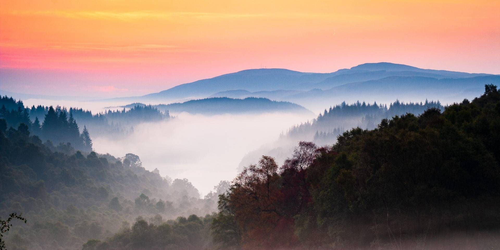 Misty dawn over Loch Drunkie, The Trossachs, Scotland.