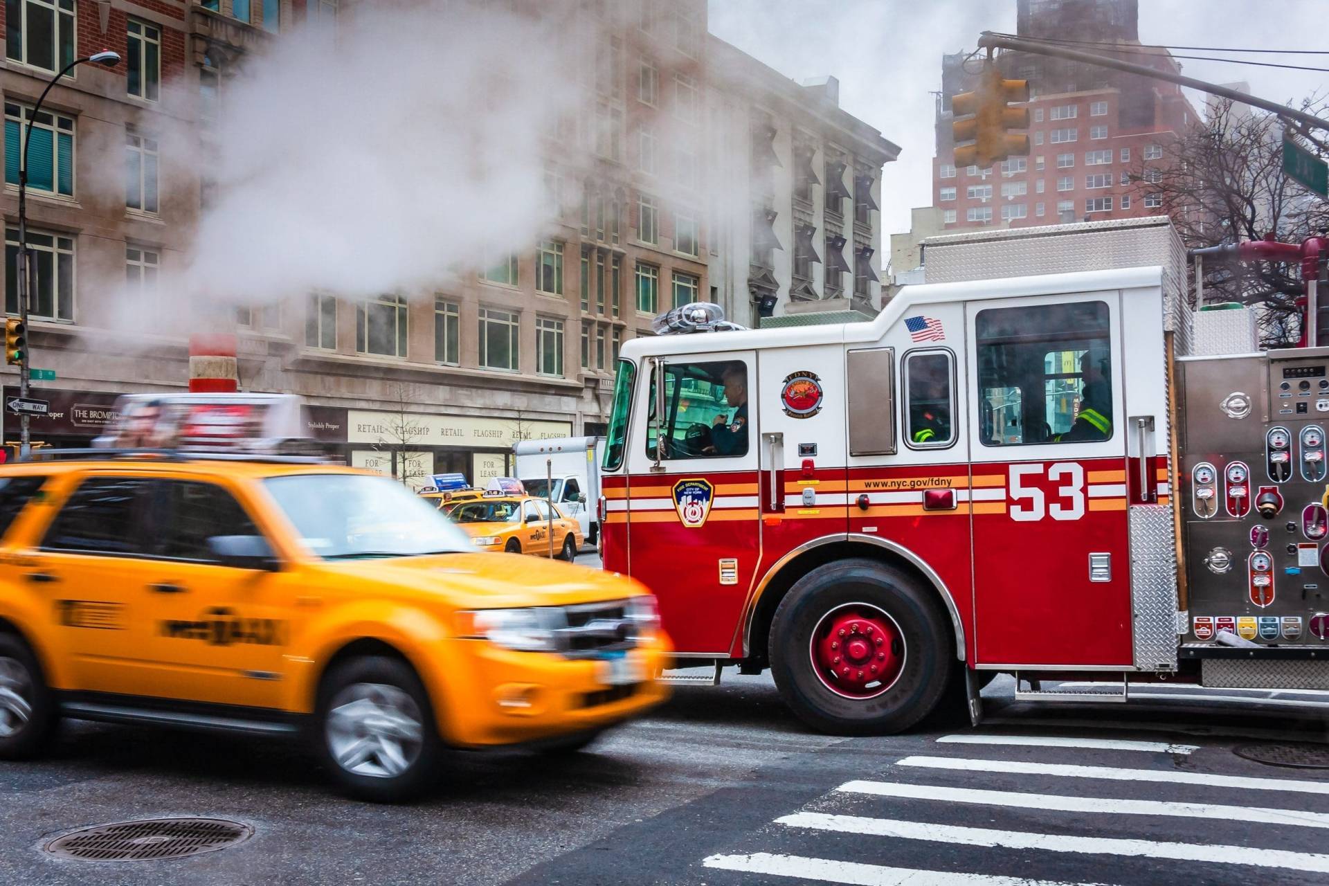 Fire engine and taxi passing on 3rd Avenue, New York City NY029